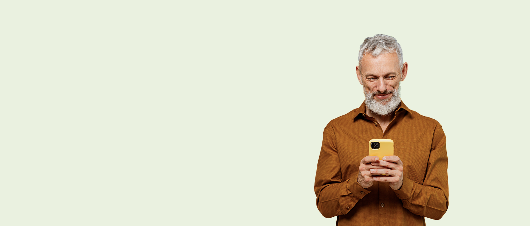 A man in a brown shirt contacting Fond Farewell on his mobile phone.