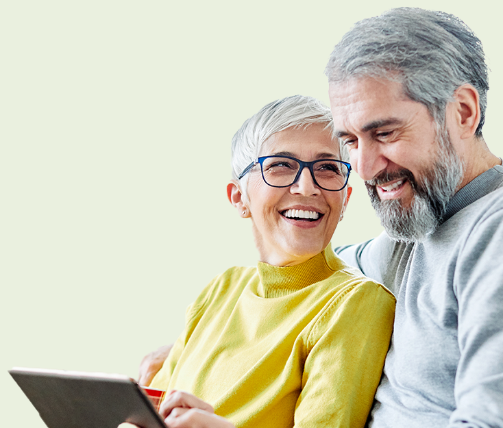 A couple searching online for a direct cremation funeral plan.